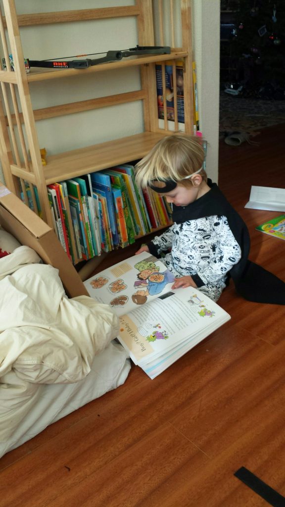 Child reading books about birth.