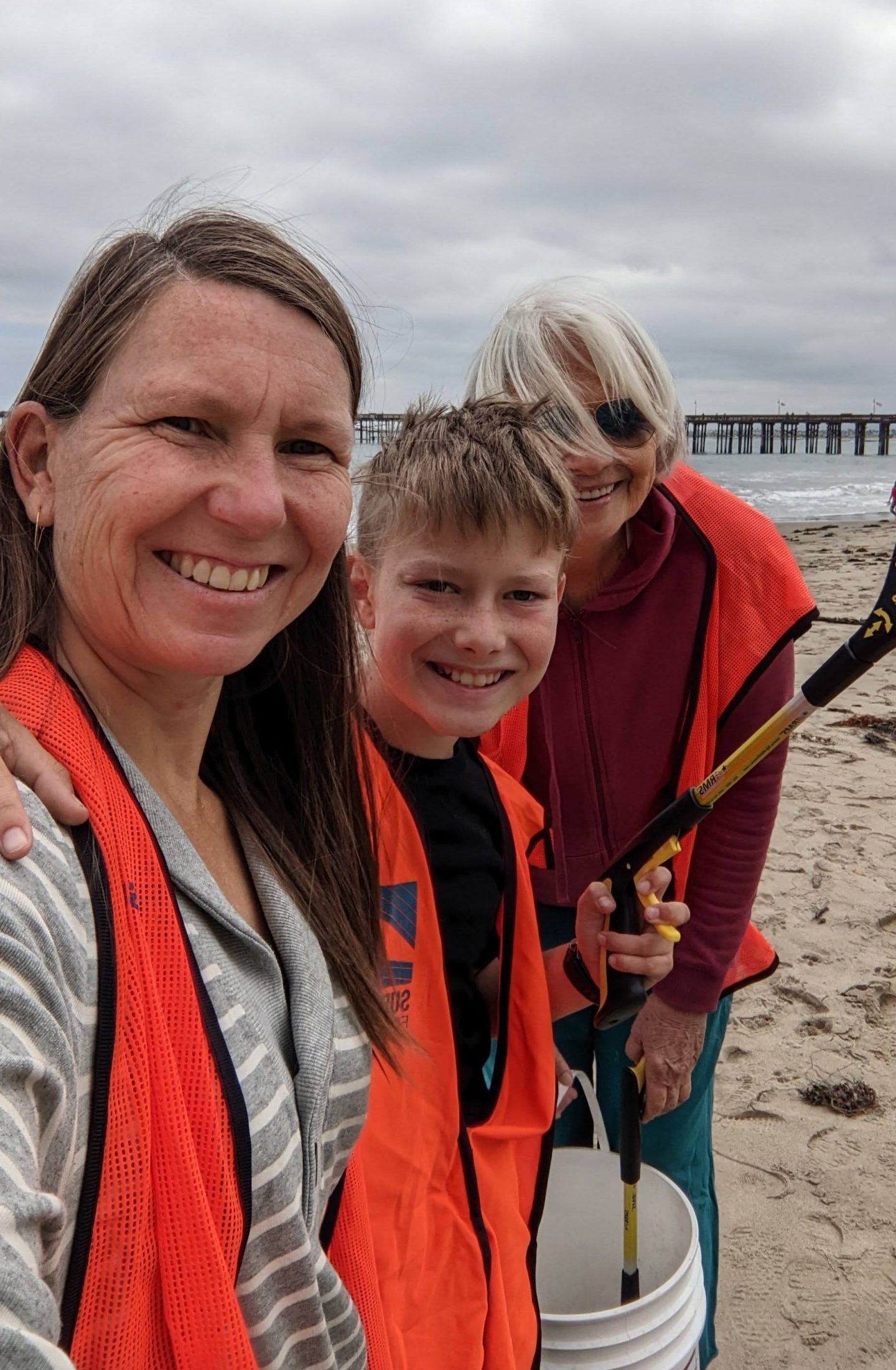 Tania with her family picking up trash at the Ventura Pier.