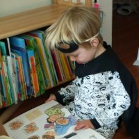 Child reading books about birth.