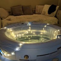 Birth pool decorated with twinkle lights and ready for a birth.