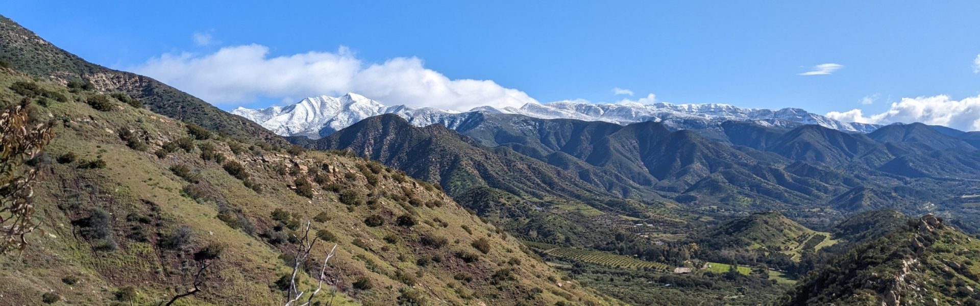 Landscape photograph of the Ojai Valley. Chief's peak is covered in snow.